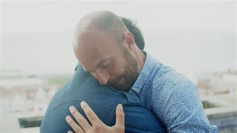 Free Stock Video Medium Shot Of Gay Couple Hugging And Then One Of Them Looks To The Camera