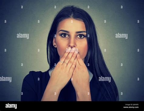 Brunette Woman Covers Her Mouth With Hands Stock Photo Alamy