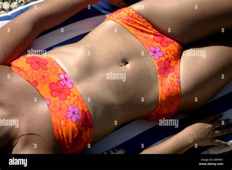 WOMAN IN BIKINI LYING ON SUNBED Stock Photo Alamy