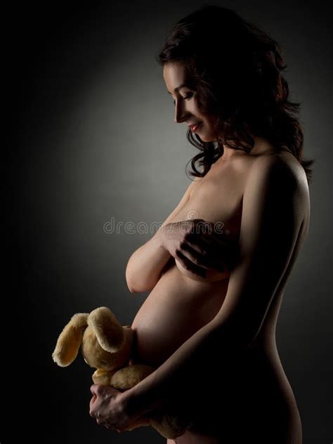 Nude Pregnant Woman Presses To Her Stomach Toy Stock Image Image Of Naked Human 161246767