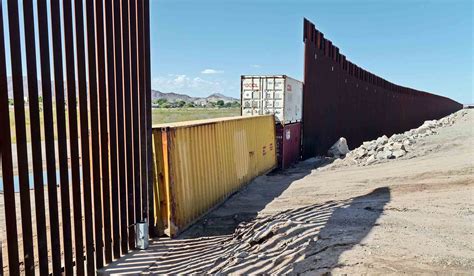 arizona shipping container wall justice department sues arizona
