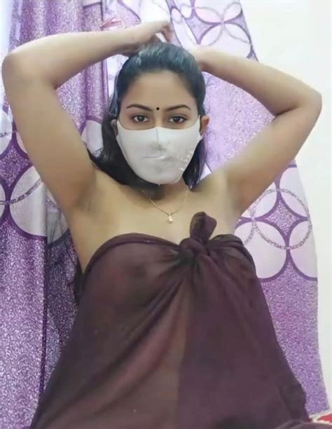 Desi MILF Covering Her Face With Mask But Shows Most Of Her Boobs In A Braless Transparent Brown
