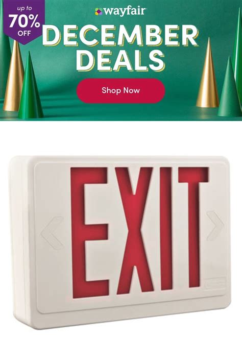 An Exit Sign With Christmas Trees In The Background