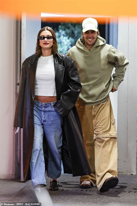 Hailey Bieber Proudly Bares Baby Bump In Crop Top And Jeans Alongside