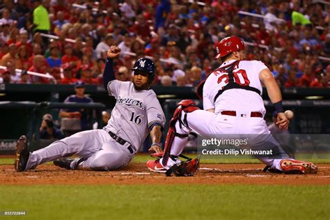 Domingo Santana Of The Milwaukee Brewers Scores A Run Against The St