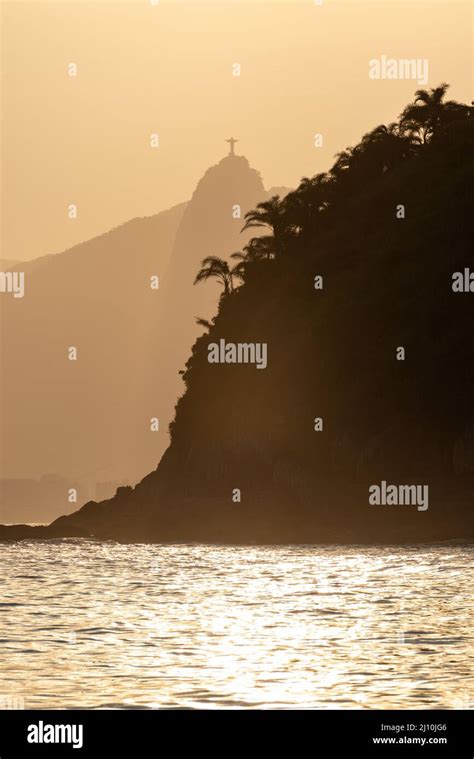 Tropical Sunset With Christ The Redeemer Monument In The Background