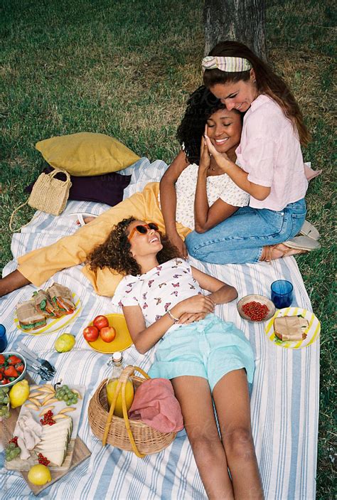 Multiethnic Lesbian Couple With Their Daughter Enjoying Picnic By Stocksy Contributor