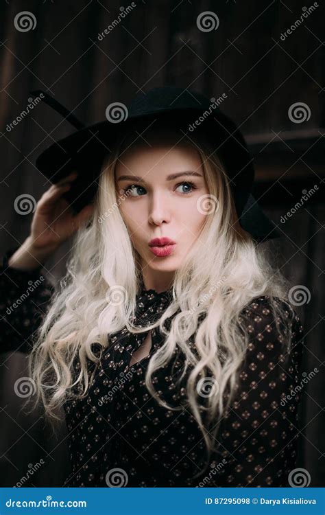 Beautiful Attractive And Stylish Girl Wearing Black Hat Standing Posing In City Nude Makeup