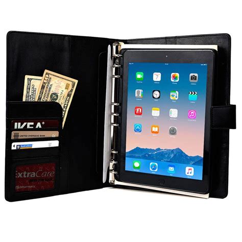 An Ipad Case Is Open With Money And Credit Cards In The Front And On