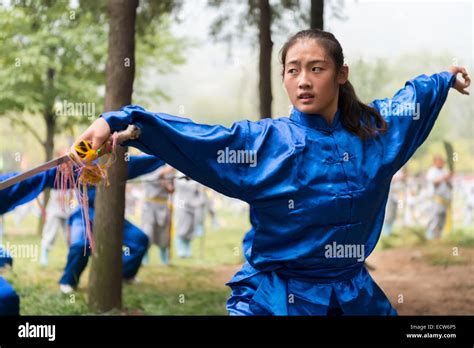 Teenage Girl Female Student Of Shaolin Martial Arts School Performing