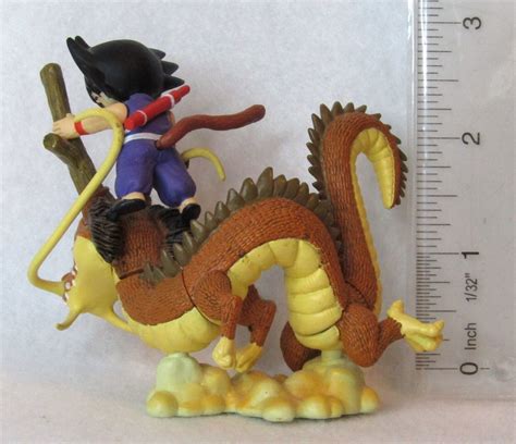 kid goku riding brown dragon dragon ball  megahouse capsule figure