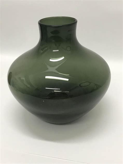 Lot An Olive Green Glass Vase