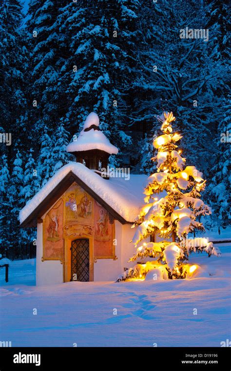 Christmas Chapel And Illuminated Tree At Evening Stock Photo Alamy
