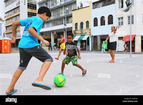 Kids Playing Soccer In The Street Brazil Stock Photo Alamy