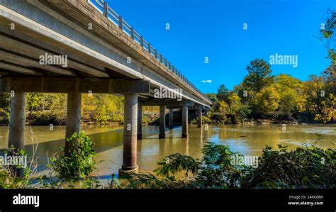 Highway bridge crossing Haw River at Swepsonvile River Park with early ...