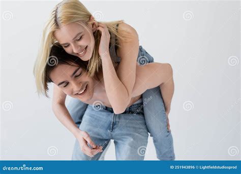Happy Blonde Woman Piggybacking On Shirtless Stock Photo Image Of