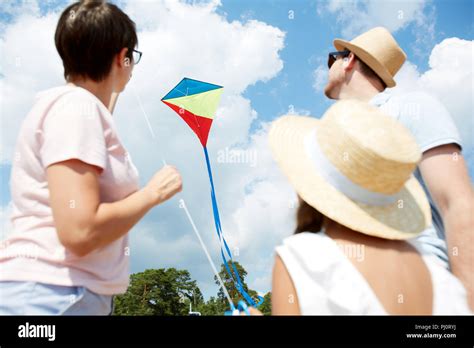 Family Flying Kite Stock Photo - Alamy