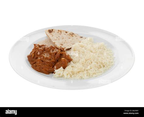 Freshly Cooked Indian Style Hot Spicy Beef Madras Curry With Basmati Rice Isolated Against A