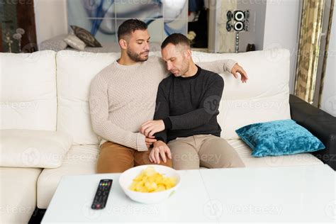 Gay Couple Chilling On Sofa At Home Stock Photo At Vecteezy