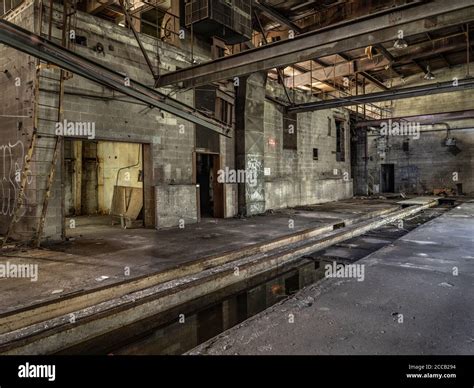 Interior of old abandoned factory warehouse Stock Photo - Alamy