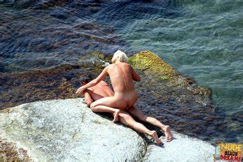 Naked Milf Playing With Her Man On The Beach Photos