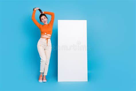 Full Body Photo Of Impressed Millennial Brunette Lady Stand Near Promo Wear Top Pants Shoes