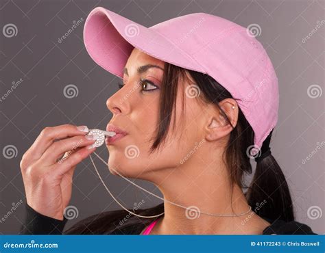 Attractive Brunette Female Blows Whistle Pink Ball Cap Whistle Stock Image Image Of Business