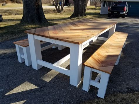 I built an oak herringbone farmhouse table with four matching benches ...