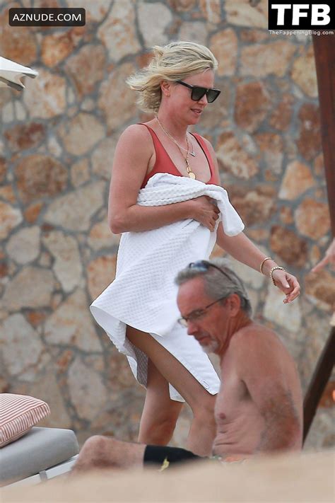 Charlize Theron Sets Pulses Racing In A Red Hot One Piece Swimsuit Aznude