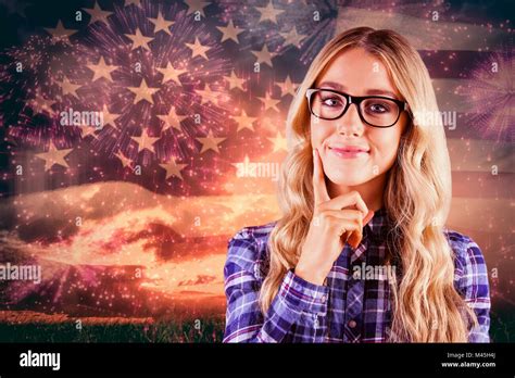 Composite Image Of Gorgeous Smiling Blonde Hipster Thinking Stock Photo