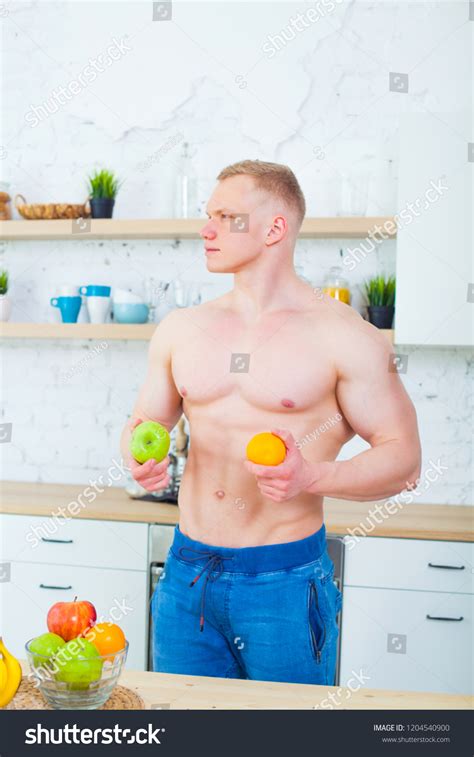 Стоковая фотография Muscular Man Naked Torso Kitchen Fruit Shutterstock