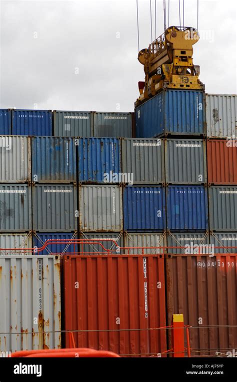 Shipping Containers Being Loaded On To The Deck Of A Container Ship