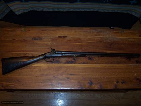 E. POWELL & SONS, 12 gauge, DOUBLE BARREL SHOTGUN WITH ORIGINAL RAMROD