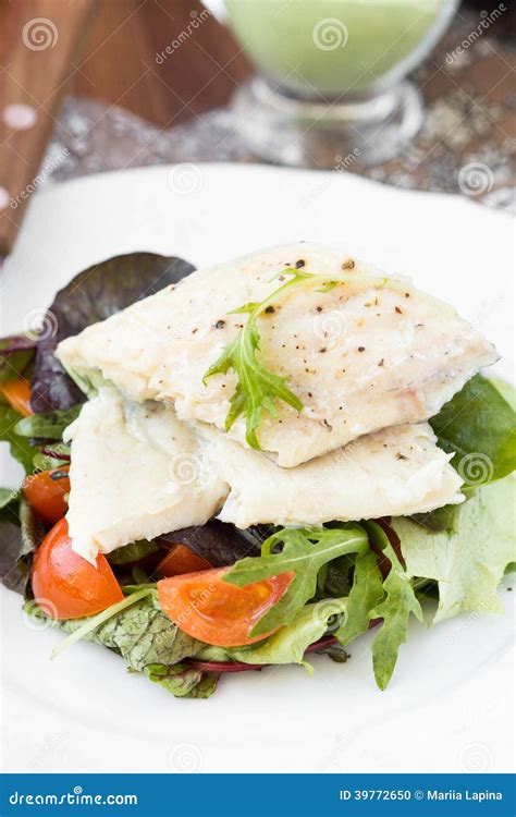Fried White Fish Fillet with Salad of Tomatoes, Arugula, Herbs Stock
