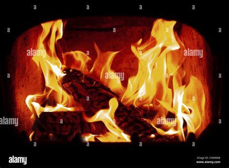 Flame Of Wooden Logs Being Burn Inside Stove Stock Photo Alamy