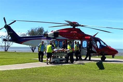 Shark attacks woman swimming at Queensland beach