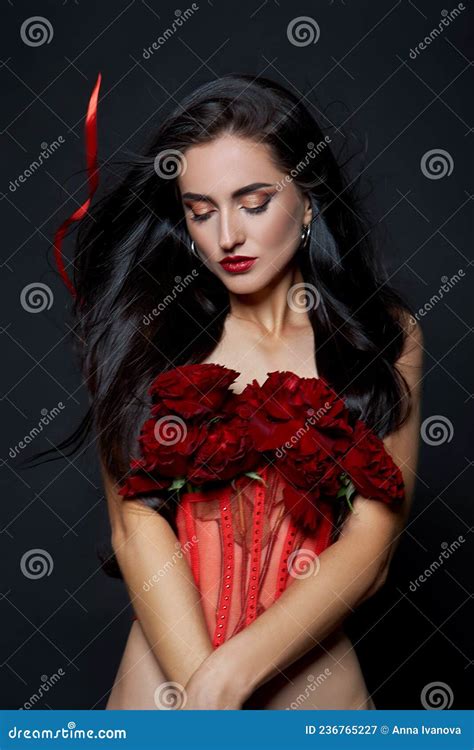 Beautiful Brunette Woman With A Bouquet Of Red Rose Flowers In Red Corset Long Hair Nude Slim