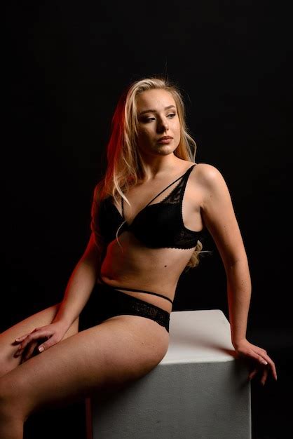 Premium Photo Attractive Plus Size Blonde Female In Lingery Standing Half Turned And Smiling