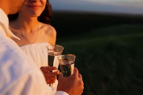 Premium Photo Newlyweds Check Glasses Of Champagne Wedding Glasses