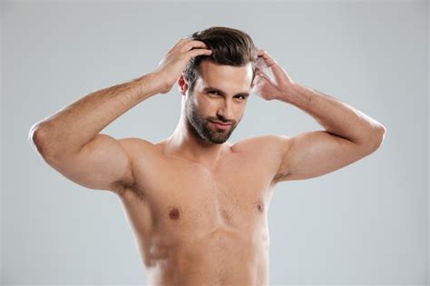 Free Photo Charming Naked Bearded Man Posing And Touching His Hair
