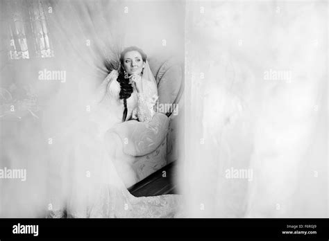 Brunette Bride Siting On Chair Stock Photo Alamy