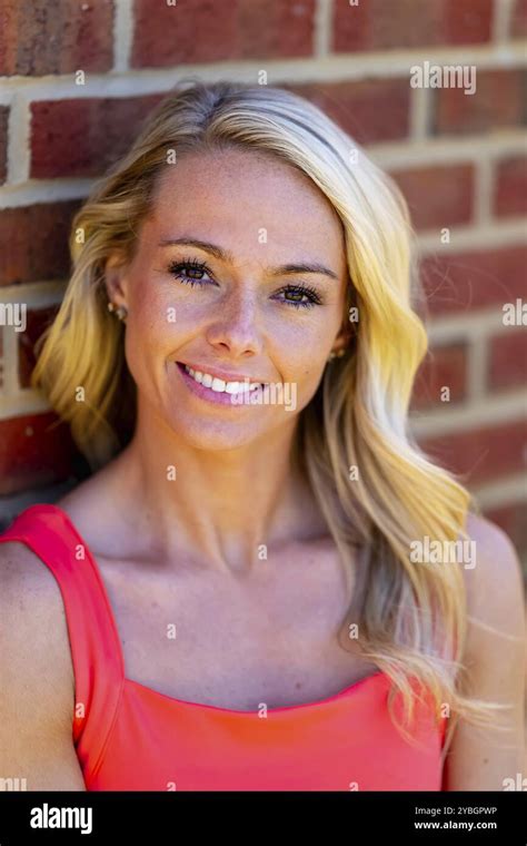 Radiant Blonde Athlete Shines At The Track On A Stunning Day Embodying Strength And Grace In