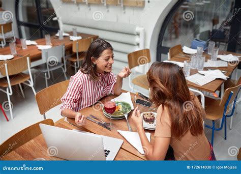 Two Women Having Lunch At Restaurant While Doing Business Friends Lesbian Conversation Stock