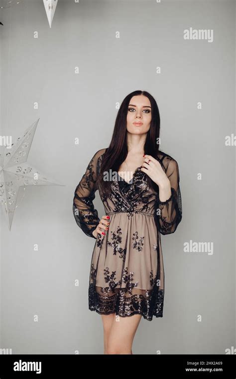 Gorgeous Brunette Model In Black Dress And Heels Stock Photo Alamy