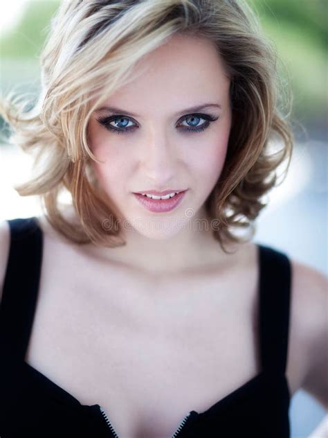 Vertical Portrait Of A Blonde Woman Looking Straight With Her Blue Eyes Stock Image Image Of