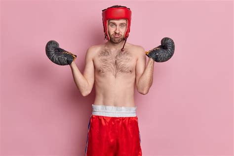 Free Photo Displeased Clueless Man Poses With Naked Torso