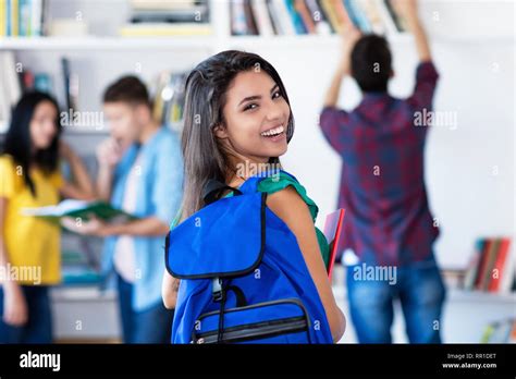 Beautiful Latin American Female Student With Group Of Students At