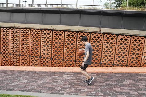 Men take a walk to relax after playing basketball in a public area