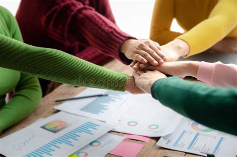 A Group Of Startup Businessmen Joining Hands Business Meetings