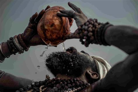 Download Aghori Drinking From Skull Wallpaper | Wallpapers.com